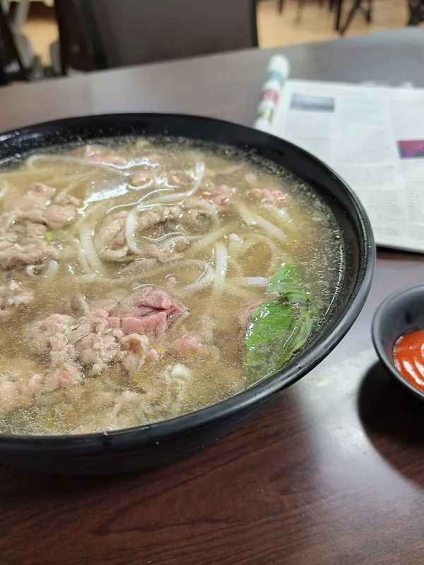 Vietnamese beef pho with The Economist